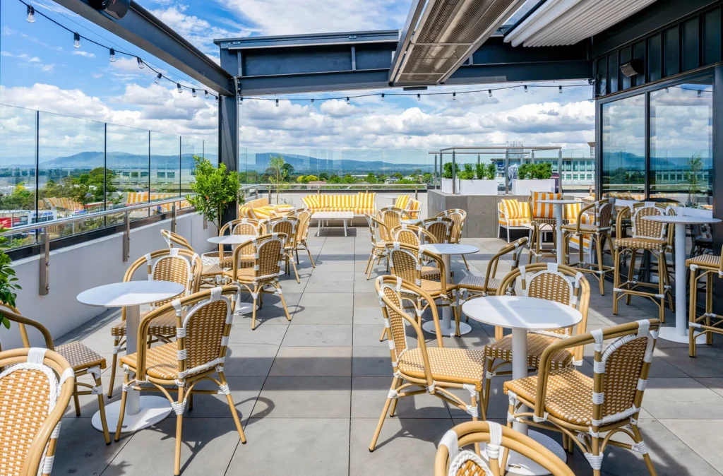 Gambino Rooftop interior with warm lighting and bar area